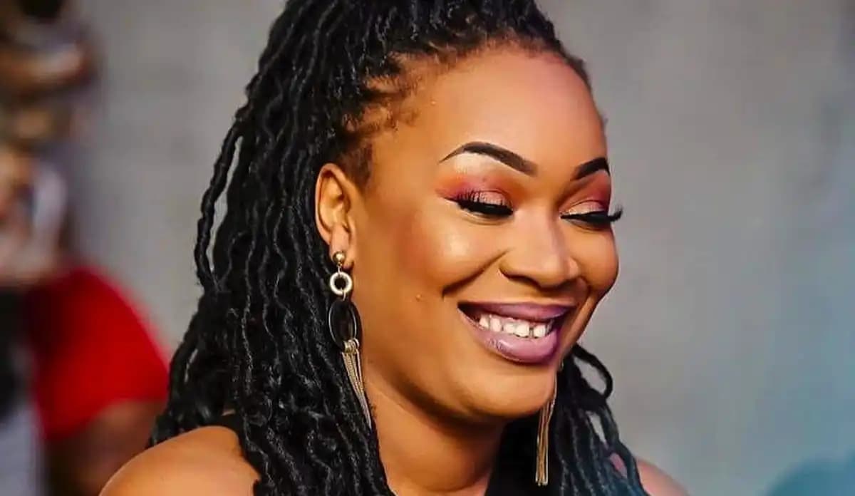 A portrait of a young woman named Josey, smiling warmly at the camera.