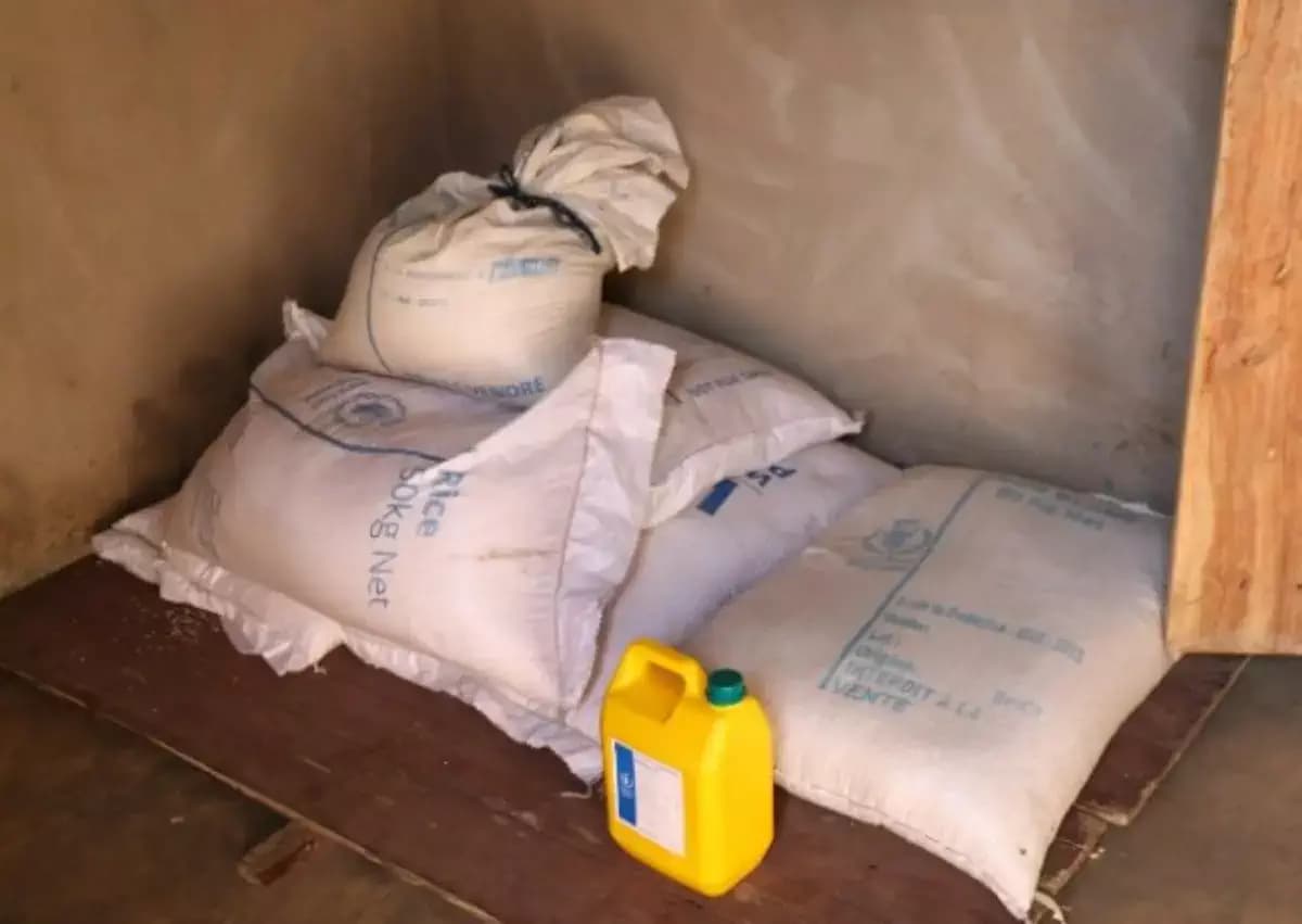 Bags of rice and oil containers for school canteens, sourced for Benin's food programs.