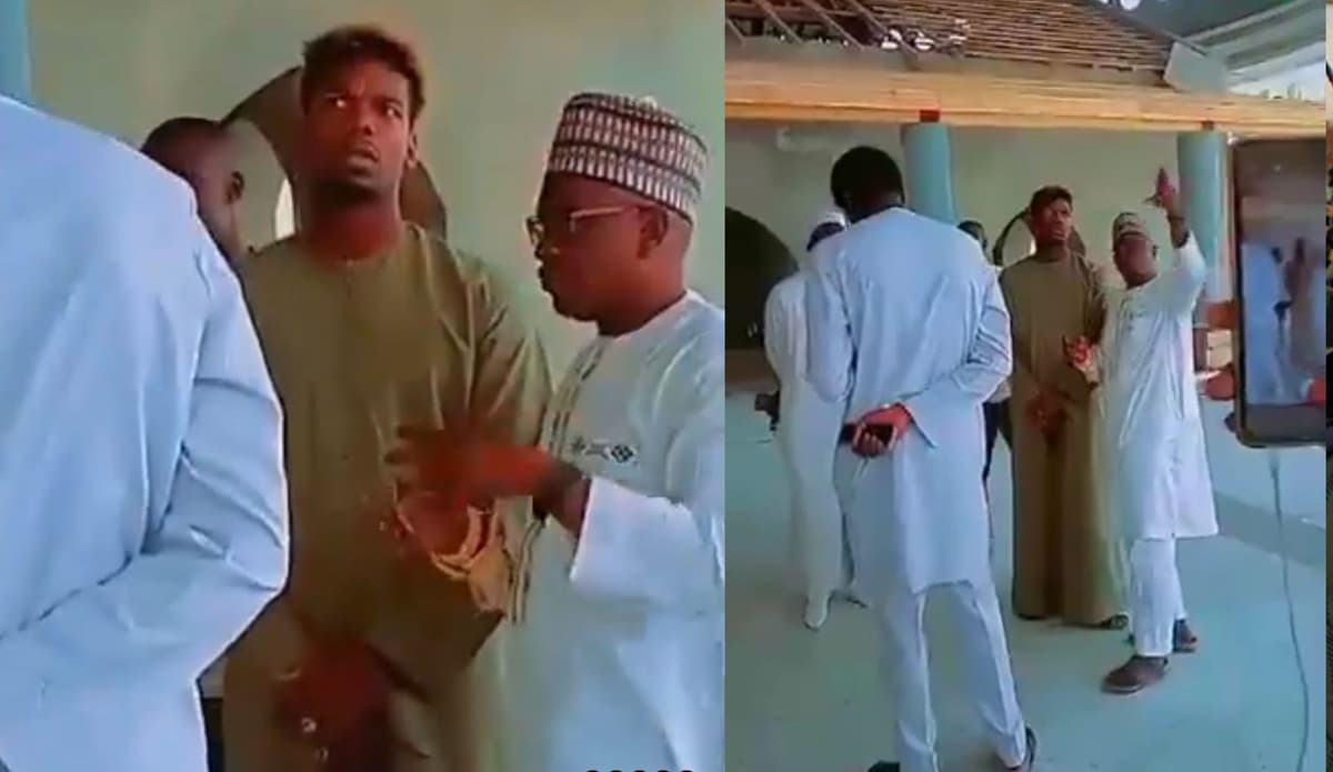 Paul Pogba souriant lors de sa visite à Dakar, entouré de fans et de médias.