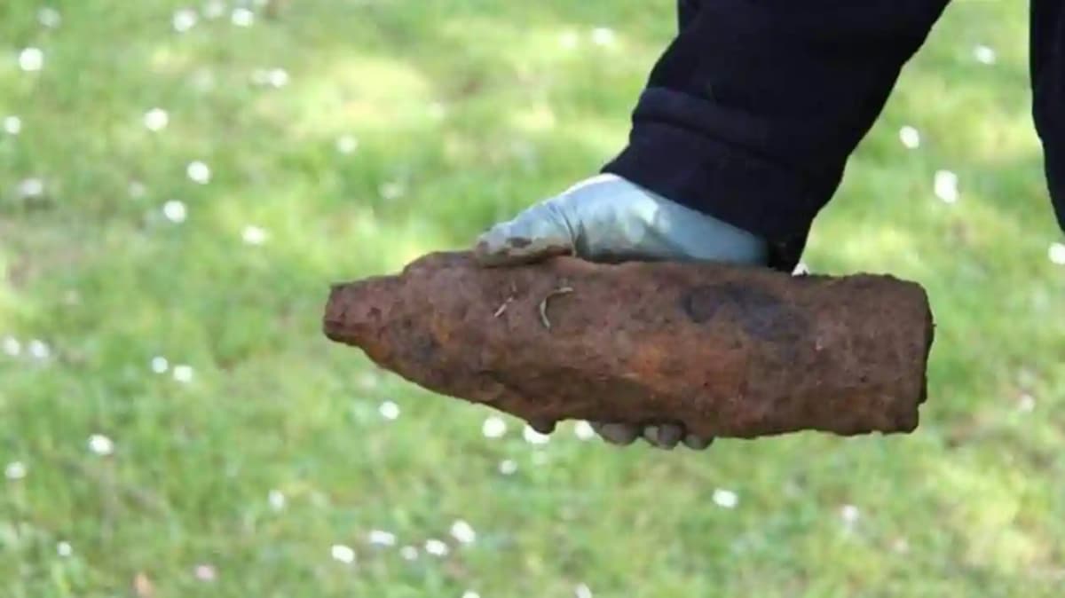 A man in his sixties dies when a wartime shell he was handling explodes at his home.